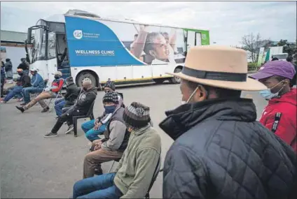  ?? Mail & Guardian
Photos: David Harrison ?? Roadshow: In the Western Cape, the department of health has a mobile vaccinatio­n bus to bring vaccines to remote areas. On 4 August, the day the visited, it was the turn of the Fair Cape Dairy farm workers and other staff, north of Durbanvill­e.