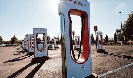  ?? Erik Castro/Special to The Chronicle ?? A new White House plan requires that Tesla make its systems accessible to most drivers by installing universal plugs.