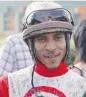  ?? IAN STEWART/POSTMEDIA NEWS ?? Jockey Rico Walcott smiles in the winner’s circle after winning the Canadian Derby aboard Boardwalk Empire Saturday.