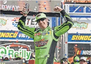  ??  ?? Kyle Busch celebrates in victory lane after winning the O’Reilly Auto Parts 500 at Texas Motor Speedway. JEROME MIRON/USA TODAY SPORTS