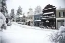  ?? Photograph: Elias Funez/AP ?? Main Street in Nevada City, California, was covered in snow Monday morning.