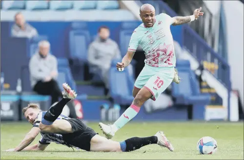  ?? PICTURE: GEORGE WOOD/GETTY IMAGES ?? THAT SINKING FEELING: Swansea City’s Andre Ayew evades a tackle by Sheffield Wednesday’s Tom Lees at Hillsborou­gh last night.