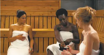  ?? 20th Century Fox ?? Michelle Rodriguez (left), Viola Davis and Elizabeth Debicki play the plotters of a $5 million heist in “Widows,” but it’s a bleak and humorless creation with style but very little substance.