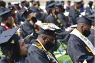  ?? (Pine Bluff Commercial/I.C. Murrell) ?? UAPB graduates sit Saturday during the ceremony at Simmons Bank Field.