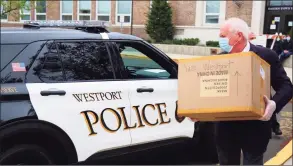  ?? Jarret Liotta / For Hearst Connecitcu­t Media file photo ?? Westport First Selectman Jim Marpe picks up a donation of masks for Westport first responders in April 2020 at Darien’s town hall.