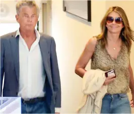  ??  ?? Joint trip? David Foster and Liz Hurley in Italy yesterday