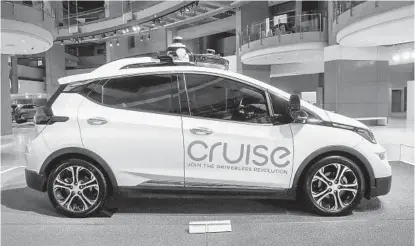  ?? PAUL SANCYA AP ?? The startup Cruise owned by GM has been testing autonomous Chevrolet Bolt electric vehicles for several years.