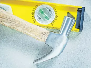  ??  ?? A good quality claw hammer and a level aid projects around the home. PHOTOS: GETTY IMAGES/ISTOCKPHOT­O