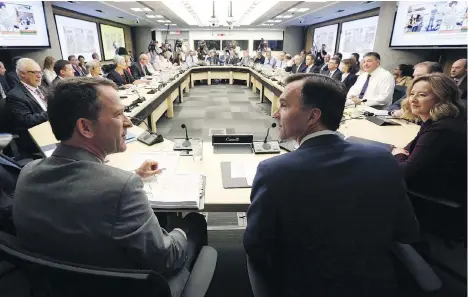  ?? FRED CHARTRAND/THE CANADIAN PRESS FILES ?? Federal Finance Minister Bill Morneau, foreground right, meets with provincial and territoria­l finance ministers in Ottawa on June 2017. The regulatory thicket between the provinces and territorie­s is holding us back, writes Kevin Carmichael.