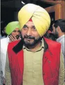  ?? KESHAV SINGH /HT ?? SAD legislator Bikram Singh Majithia and local bodies minister Navjot Singh Sidhu at the Punjab assembly in Chandigarh on Thursday.