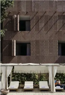  ?? by André J Fanthome, right image by Rajen Nandwana ?? Architectu­re and interior design firm Studio Lotus is at the forefront of adaptive reuse in India. Its design for the distinctiv­e handcrafte­d, hinged windows of RAAS, a boutique hotel project made up of restored 18thcentur­y buildings and a trio of new ones in the historic Walled City of Jodhpur, reinterpre­ts the traditiona­l jali perforated screen