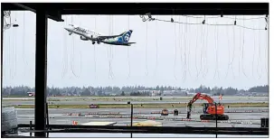  ?? AP file photo ?? This April photo shows constructi­on underway at Seattle-Tacoma Internatio­nal Airport. Airports across the country are spending record amounts on expansion and improvemen­t projects.
