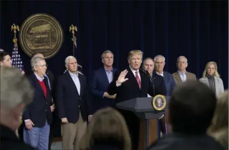 ?? ANDREW HARNIK — THE ASSOCIATED PRESS ?? President Donald Trump, fifth from right, accompanie­d by from left, House Speaker Paul Ryan of Wis., Senate Majority Leader Mitch McConnell of Ky., Vice President Mike Pence, House Majority Leader Kevin McCarthy of Calif., House Majority Whip Steve...