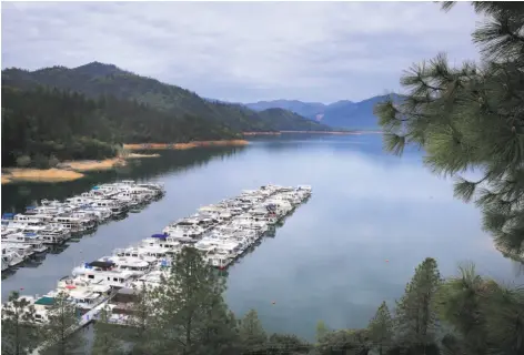  ?? Michael Macor / The Chronicle ?? Raising Shasta Dam’s height would affect businesses like the Bay Bridge Marina with its houseboats and inundate sacred Indian sites.