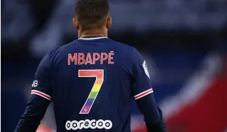  ?? Credit: AFP ?? Paris Saint-Germain's French forward Kylian Mbappe wearing a jersey in the colour of the rainbow flag.