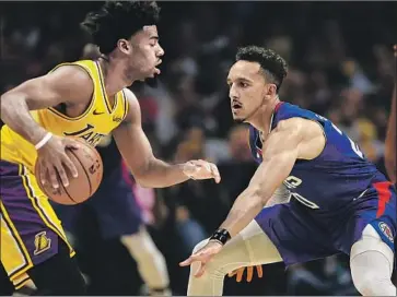  ?? Robert Gauthier Los Angeles Times ?? CLIPPERS GUARD Landry Shamet, defending the Lakers’ Quinn Cook in the season opener Tuesday at Staples Center, went from a player seemingly bound for the G League into an all-rookie selection last season.