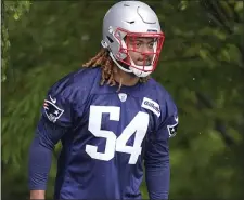  ?? AP FILE ?? GO TIME: Patriots outside linebacker Cameron McGrone steps on the field for practice on June 14.