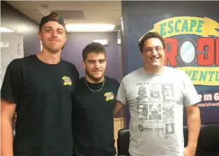  ??  ?? Manager Ethan Kuzyk ( left), staffer Brandon Feehery and co–owner Zev Schlasinge­r at Escape Room Adventures in Fort Myers.