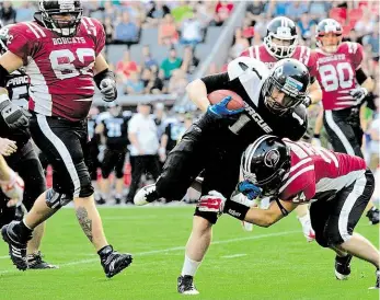  ?? Foto: Michal Kamaryt, ČTK ?? Obhájí titul? Tým Prague Black Panthers vyhrál ligu čtyřikrát v řadě, v tomhle finále proti Příbram Bobcats, kteří před letošní sezonou zažádali o přeřazení do třetí nejvyšší soutěže.