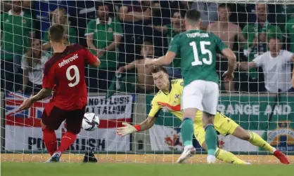  ?? Northern Ireland’s goalkeeper Bailey Peacock-Farrell saves Haris Seferovic’s penalty. Photograph: Peter Morrison/AP ??