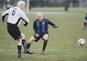  ??  ?? Mill View SC (blue stripes) battle against Seaham Marlboroug­h in their Over-40s Ironside Cup semi last week