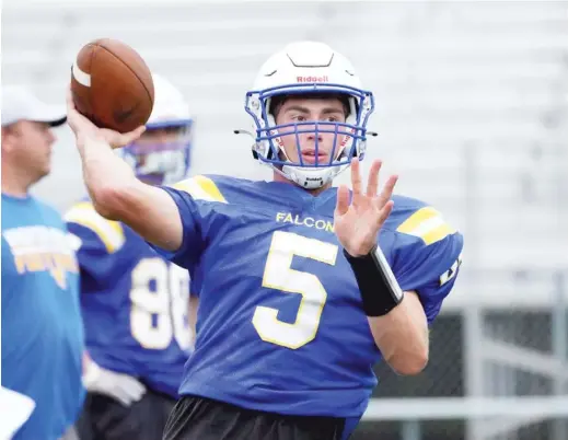  ?? KEVIN TANAKA/SUN TIMES ?? Wheaton North quarterbac­k Mark Forcucci, throwing in practice Wednesday, threw for 919 yards and 12 touchdowns in six games last spring.