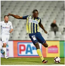  ?? — AFP ?? On target: Usain Bolt taking a shot at goal in the match between A-League sides Central Coast Mariners and Macarthur South West United in Sydney on Friday.