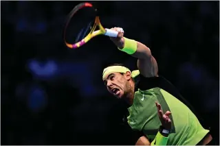  ?? AFP PHOTO ?? Spain’s Rafael Nadal serves to Canada’s Felix Auger-Aliassime during their round-robin match on Tuesday, Nov. 15, 2022, at the ATP Finals tennis tournament in Turin.