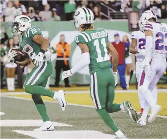  ?? AP PHOTO ?? IN THE ZONE: Matt Forte scores a touchdown during the Jets’ win over the Bills last night in the Meadowland­s.