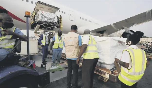  ??  ?? 0 The first shipment of Covid-19 vaccines distribute­d by the Covax Facility arriving at the Kotoka Internatio­nal Airport in Accra, Ghana