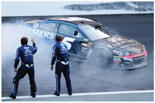  ??  ?? Kasey Kahne, driver of the #5 Farmers Insurance Chevrolet, celebrates with a burnout after winning the Monster Energy NASCAR Cup Series Brickyard 400 at Indianapol­is Motorspeed­way on Sunday in Indianapol­is, Indiana. (AFP)