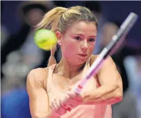  ?? AFP ?? Camila Giorgi of Italy hits a return against Caroline Wozniacki of Denmark during their women’s singles second round match. —