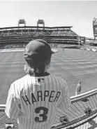  ?? MATT ROURKE/AP ?? Bryce Harper fans watch batting practice before Thursday’s game at Citizens Bank Park that attracted a crowd of more than 43,000.