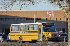  ?? RYAN HERMENS / THE PADUCAH SUN ?? A school bus leaves Marshall County High School in Benton, Ky., on Friday, the first day of classes since a Tuesday shooting in which two students were killed and 14 others wounded when a 15-year-old boy opened fire.