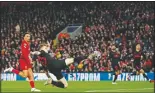  ?? (File Photo/AP/Jon Super) ?? Atletico Madrid’s Kieran Trippier attempts a shot at goal in front of Liverpool’s Trent Alexander-Arnold on March 11, 2020, during a second leg, round of 16, Champions League soccer match between Liverpool and Atletico Madrid at a packed Anfield stadium in Liverpool, England.