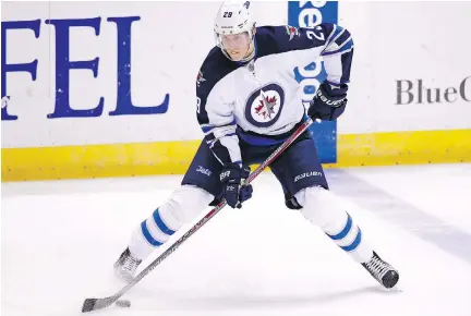  ?? BILLY HURST/THE ASSOCIATED PRESS ?? At just 18, the Winnipeg Jets’ Patrik Laine has spent the season near the top of the NHL’s goal-scoring race.