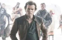  ?? LUCASFILM ?? In “Solo,” Han Solo (Alden Ehrenreich), future hero but current smuggler and general scoundrel, meets Chewbacca the Wookiee and encounters the notorious gambler and also future hero Lando Calrissian.