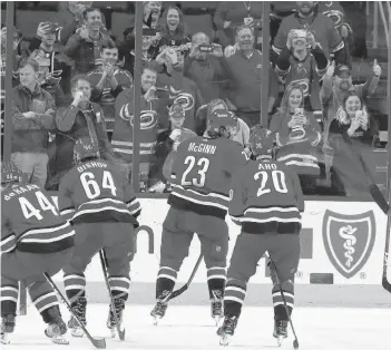  ?? CP PHOTO ?? Carolina Hurricanes skate toward the crowd during an on ice celebratio­n following their 2-1 win over the New Jersey Devils at an NHL game, Nov. 18, 2018, in Raleigh, N.C. Don Cherry’s latest rant about the Carolina Hurricanes and their victory celebratio­ns didn’t go unnoticed by the NHL club. They’ve even decided to embrace his words.