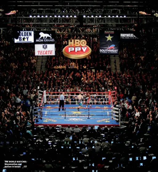  ?? Photo: GETTY IMAGES ?? THE WORLD WATCHES: Mayweather and Hatton in battle