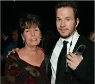  ?? ASSOCIATED PRESS ?? In this Sunday, Jan. 16, 2005, file photo, Mark Wahlberg, executive producer of the HBO series “Entourage,” and his mother Alma pose at the HBO party after the 62nd Annual Golden Globe Awards, in Beverly Hills, Calif.