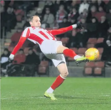  ??  ?? Luke Varney volleys home the winning goal for Cheltenham