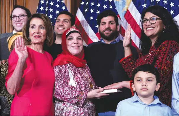  ?? (Joshua Roberts/Reuters) ?? REP. RASHIDA Tlaib (D-Michigan, far right) poses with Speaker of the House Nancy Pelosi (D-California) for a ceremonial swearing-in picture on Capitol Hill on January 3.