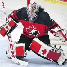  ?? JASON KRYK/THE CANADIAN PRESS ?? Canada goaltender Shannon Szabados, seen during Monday’s game against Russia at the world championsh­ips in Plymouth, Mich., says she’d like to play in “one more Olympics.”