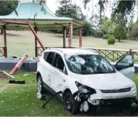  ??  ?? Above: A stolen car was abandoned and pushed down the Civic Park hill during the early hours of Friday morning, crashing through two sides of the band rotunda.