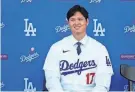  ?? ASHLEY LANDIS/AP ?? The Dodgers’ Shohei Ohtani answers questions during a news conference at Dodger Stadium on Dec. 14 in Los Angeles.