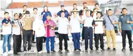  ??  ?? Masiung (front centre) with a delegation on a working visit to the SUKMA venues in Perak, Tuesday.