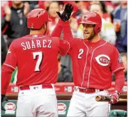  ?? DAVID JABLONSKI / STAFF ?? Zack Cozart (right) was a first-time All-Star last year and set career highs in batting average (.297) and home runs (24).