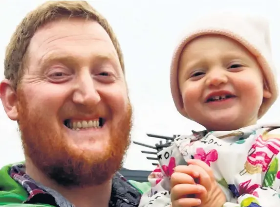  ??  ?? > ‘People can’t get their heads around the fact that my daughter can speak and understand two languages’ – Siôn Tomos Owen with his two-year-old daughter, Eira