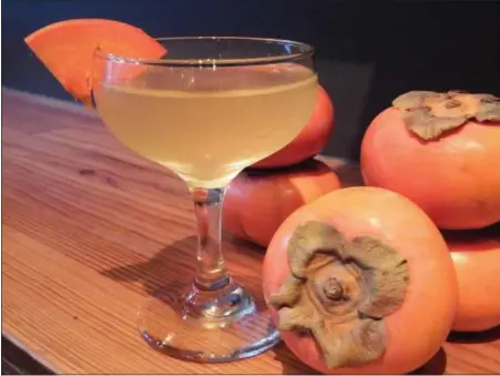 ?? PHOTO COURTESY OF GATHER ?? Gather’s Persimmon of Interest isn’t labeled a skinny cocktail but the martini-like cocktail is low in calories, a perfect seasonal sipper for those new year’s resolution­s.