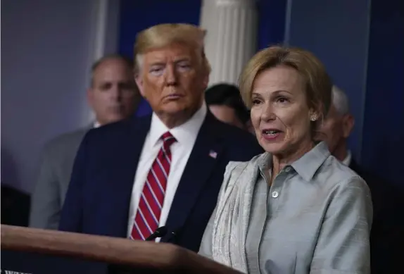  ?? AP FILE ?? THAT HAPPENED: Then-President Donald Trump listens to Dr. Deborah Birx give a coronaviru­s briefing a year ago at the White House.